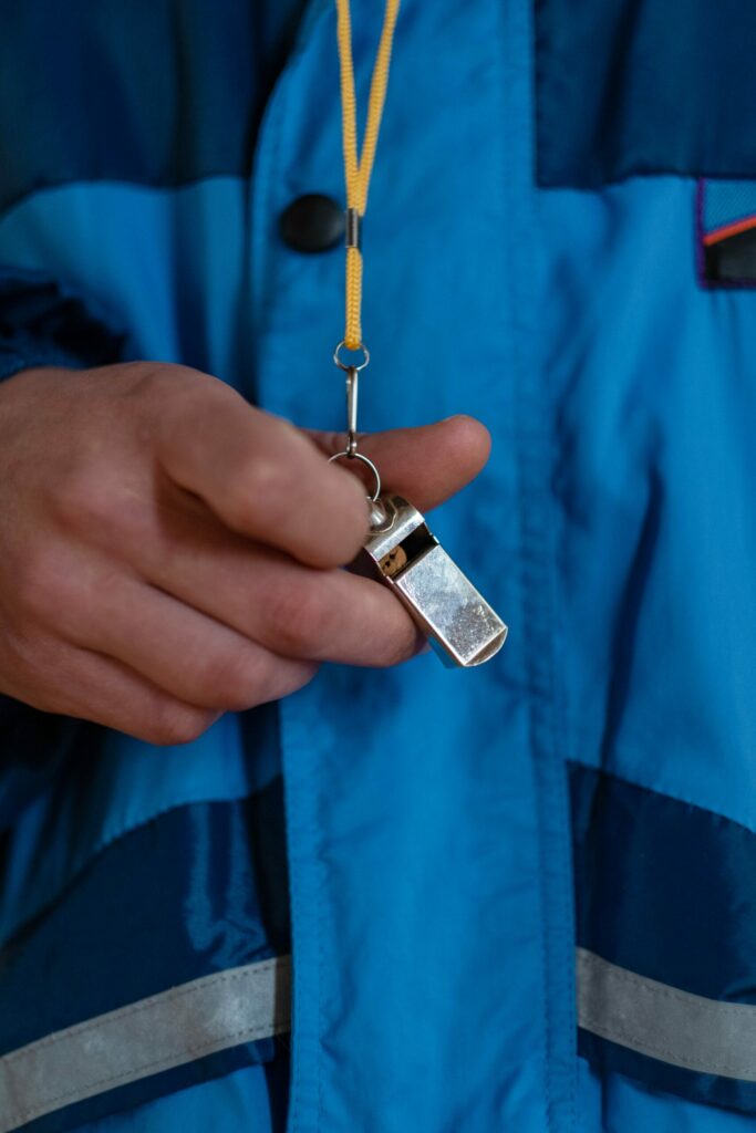 Coach holding a whistle